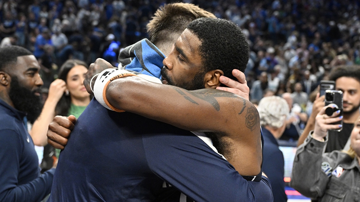 Dallas Mavericks guard Luka Doncic (77) and guard Kyrie Irving (11) embrace after the win against the Minnesota Timberwolves in game three of the western conference finals for the 2024 NBA playoffs at American Airlines Center.