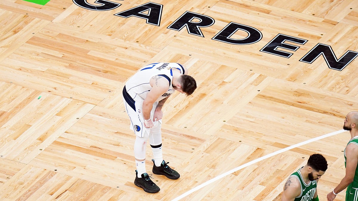 Dallas Mavericks guard Luka Doncic (77) reacts in the fourth quarter against the Boston Celtics during game five of the 2024 NBA Finals at TD Garden.