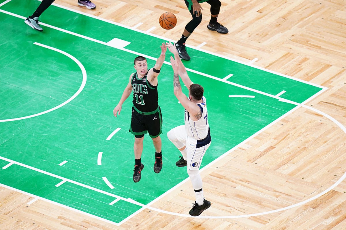 Dallas Mavericks guard Luka Doncic (77) shoots against Boston Celtics guard Payton Pritchard (11) in the fourth quarter during game two of the 2024 NBA Finals at TD Garden. 