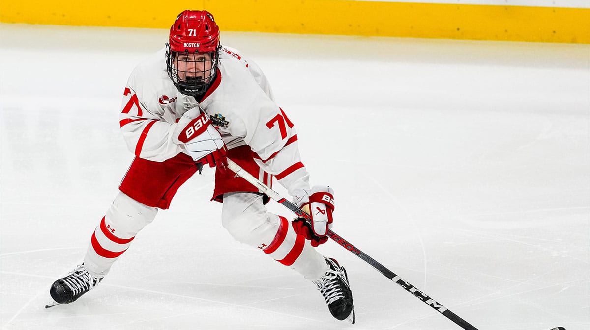 Boston U. forward Macklin Celebrini (71) carries the puck in the semifinals of the 2024 Frozen Four college ice hockey tournament during the third period against Denver at Xcel Energy Center. 