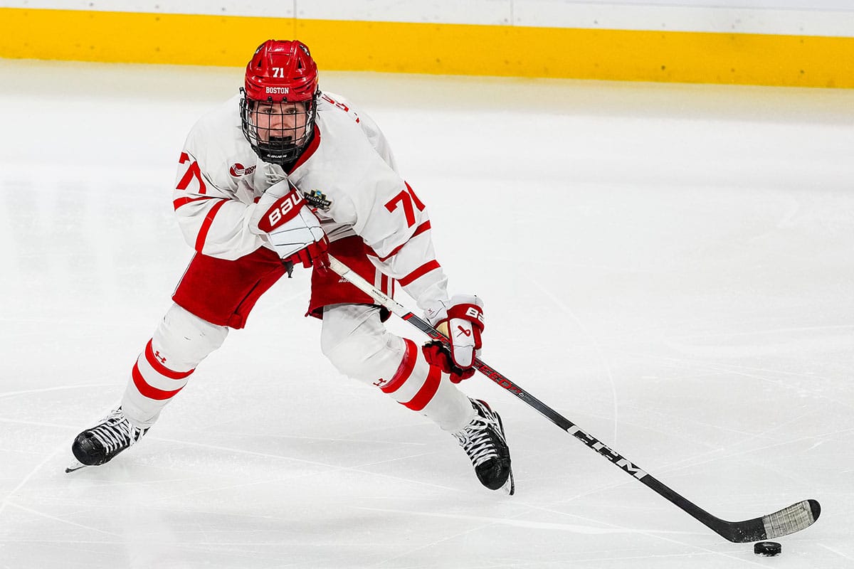 Boston U. forward Macklin Celebrini (71) carries the puck in the semifinals of the 2024 Frozen Four college ice hockey tournament during the third period against Denver at Xcel Energy Center.