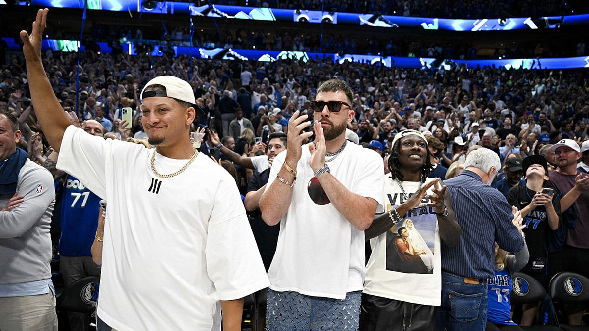 Kansas City Chiefs quarterback Patrick Mahomes (left) and tight end Travis Kelce (center) and Hollywood Brown (right) celebrate after game three between the Dallas Mavericks and the Minnesota Timberwolves in the western conference finals for the 2024 NBA playoffs at American Airlines Center.