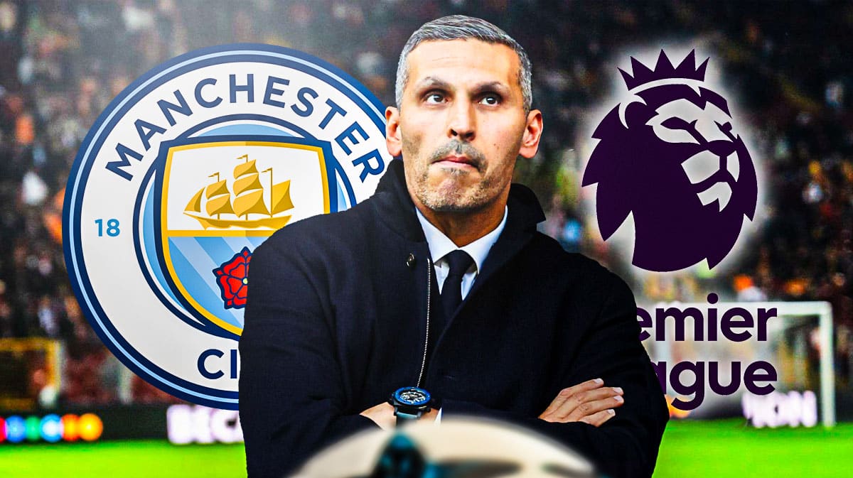 Khaldoon Al Mubarak in front of the Manchester City and Premier League logos