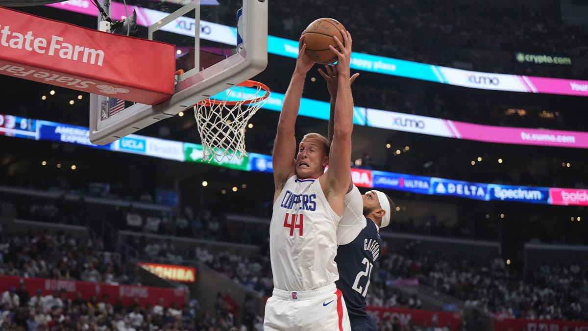 LA Clippers center Mason Plumlee (44) rebounds the ball against Dallas Mavericks center Daniel Gafford (21) during game five of the first round for the 2024 NBA playoffs at Crypto.com Arena. 