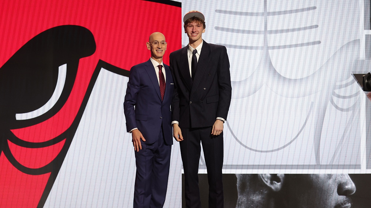 Matas Buzelis poses for photos with NBA commissioner Adam Silver after being selected in the first round by the Chicago Bulls in the 2024 NBA Draft at Barclays Center. 