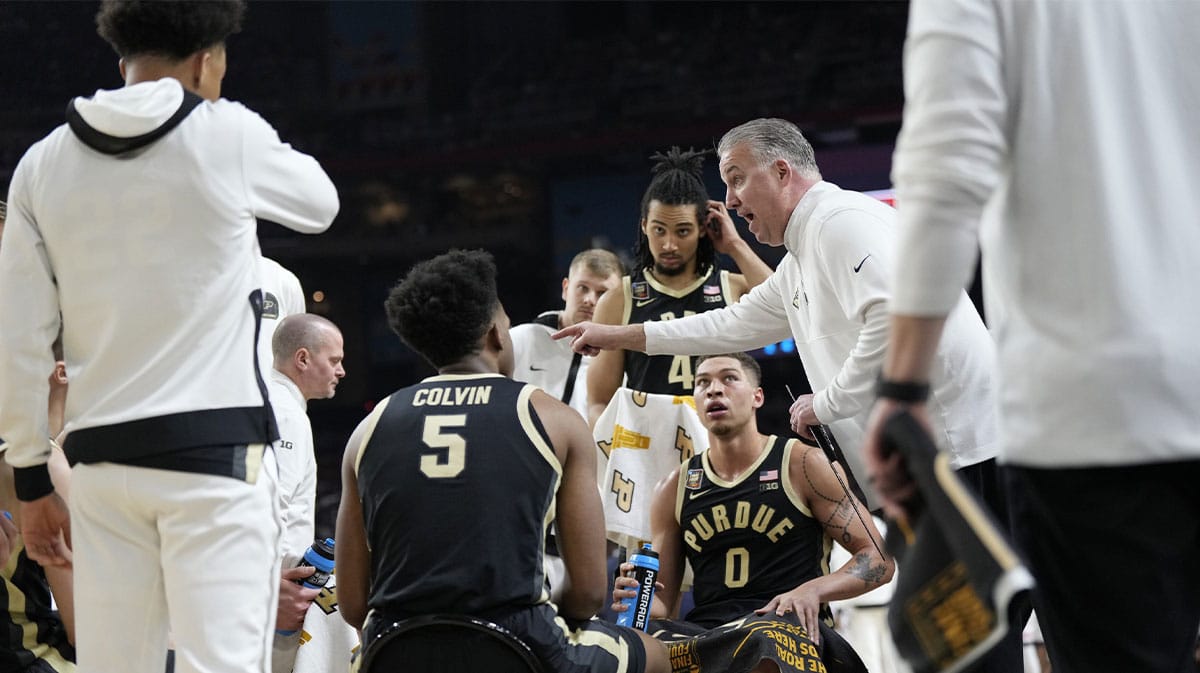 Purdue Boilermakers head coach Matt Painter talks to his team during a timeout at the Men's NCAA national championship game against the Connecticut Huskies