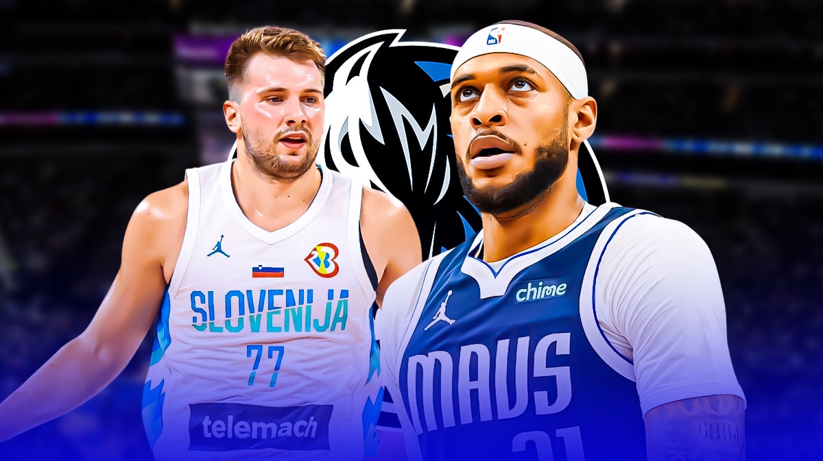 Mavericks' Daniel Gafford stands next to Luka Doncic in Slovenia gear before Olympics