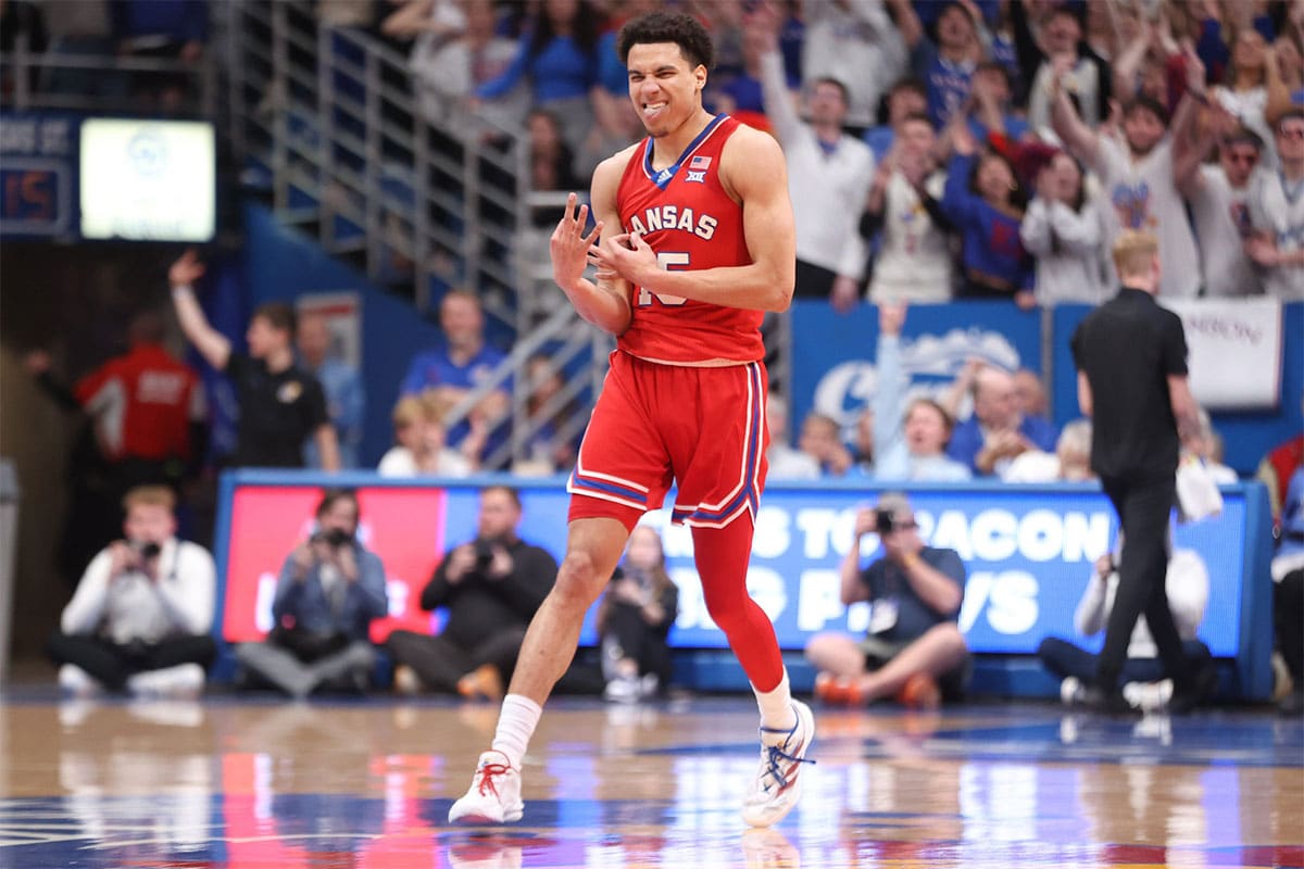 Kansas graduate senior guard Kevin McCullar Jr. (15) reacts after sinking a three against Kansas State in the first half of the Sunflower Showdown inside Allen Fieldhouse Tuesday, March 5, 2024.