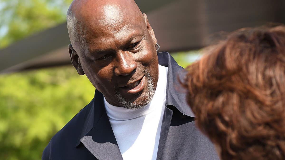 Michael Jordan takes the time to pose for a few photos and greet spectators and friends outside of The Michael Jordan Family Medical Clinic led by Novant Health. A ribbon cutting ceremony for the new clinic opening off of Greenfield Street 