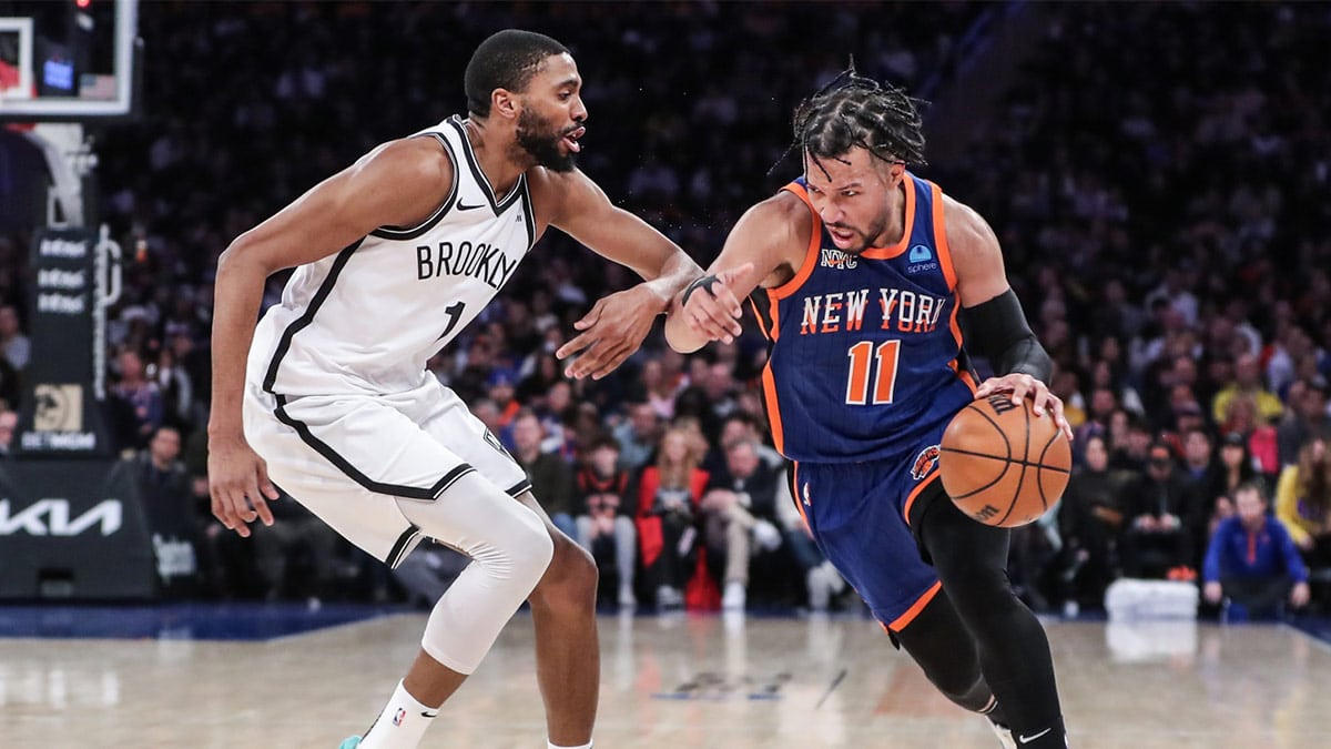 New York Knicks guard Jalen Brunson (11) drives past Brooklyn Nets forward Mikal Bridges (1) in the third quarter at Madison Square Garden