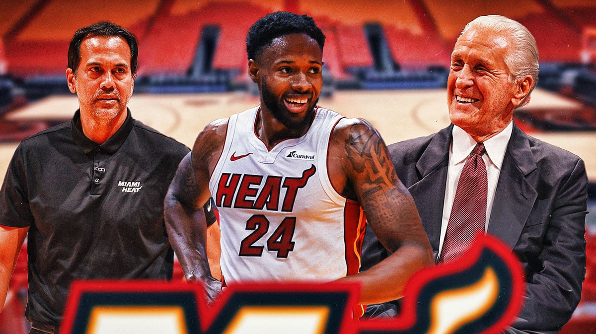 Miami Heat star Haywood Highsmith, president Pat Riley, and head coach Erik Spoelstra in front of Kaseya Center.