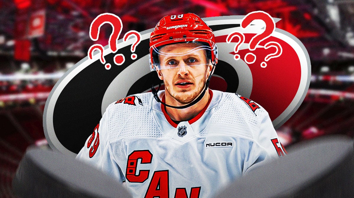 Jake Guentzel looking stern, Carolina Hurricanes logo, 3-5 question marks, hockey rink in background