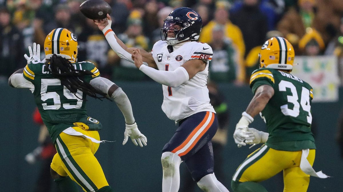 Chicago Bears quarterback Justin Fields (1) throws a pass against the Green Bay Packers on Sunday, January 7, 2024, at Lambeau Field in Green Bay, Wis. The Packers won the game, 17-9, to clinch an NFC playoff berth.