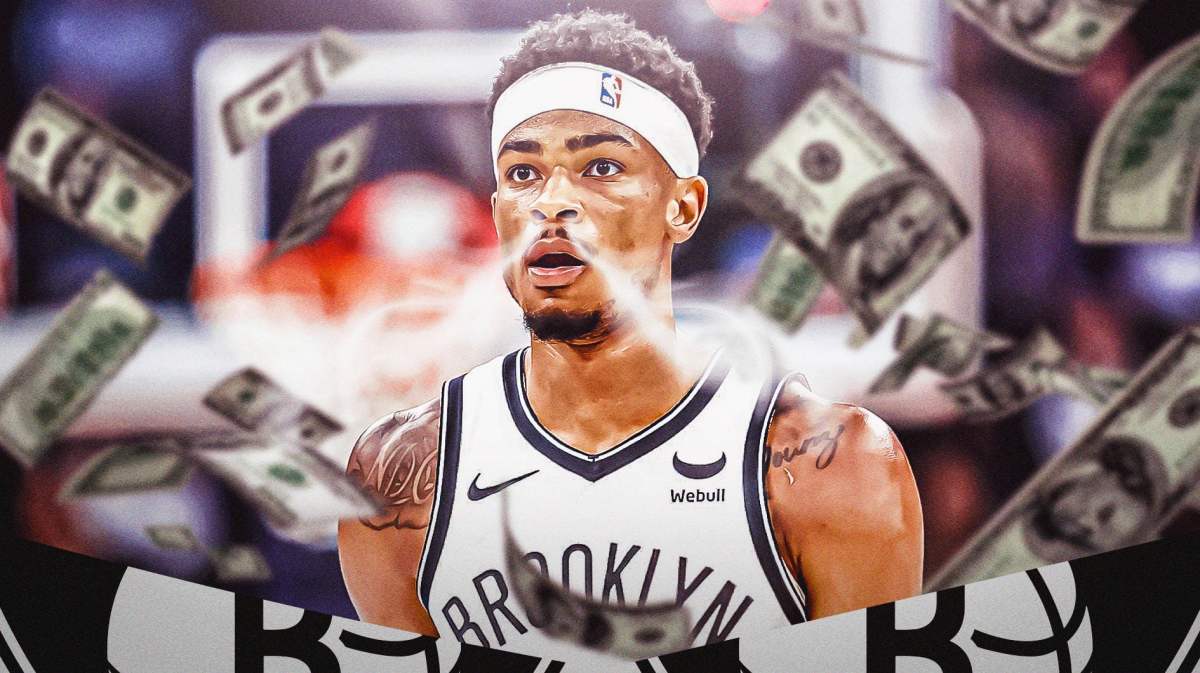 Nic Claxton with smoke coming out of his nose in Nets jersey with money flying around him