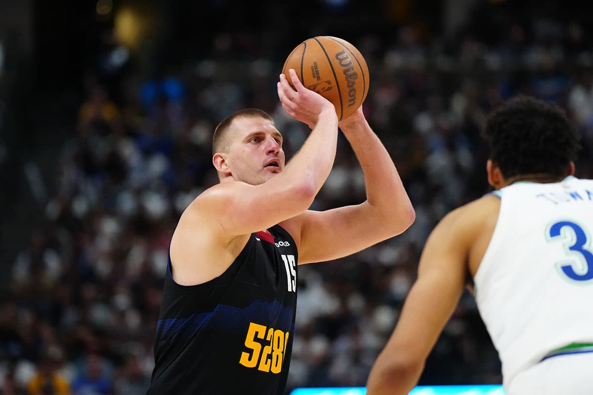 Denver Nuggets center Nikola Jokic (15) shoots the ball in the third quarter against the Minnesota Timberwolves in game seven of the second round for the 2024 NBA playoffs at Ball Arena.