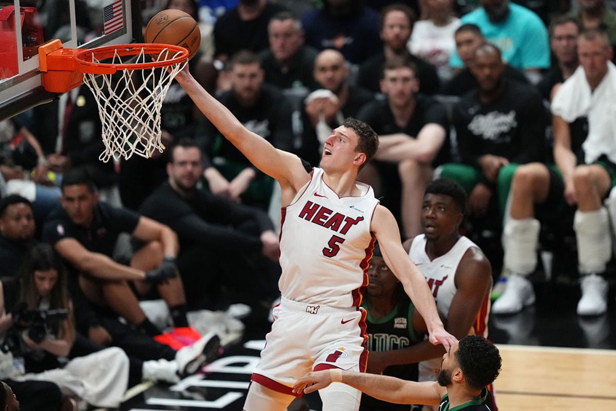 Miami Heat forward Nikola Jovic (5) drives to the basket against the Boston Celtics in the second half during game three of the first round for the 2024 NBA playoffs at Kaseya Center.