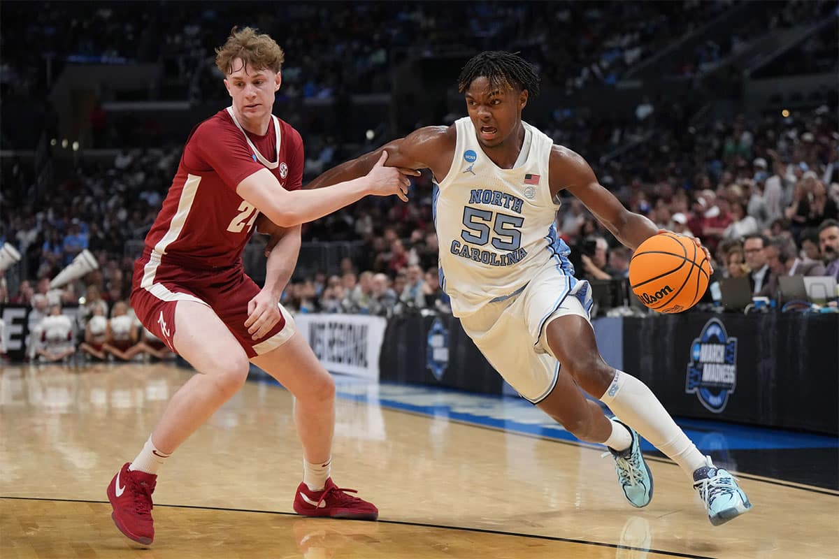 North Carolina Tar Heels forward Harrison Ingram (55) controls the ball against Alabama Crimson Tide forward Sam Walters (24) in the second half in the semifinals of the West Regional of the 2024 NCAA Tournament at Crypto.com Arena.