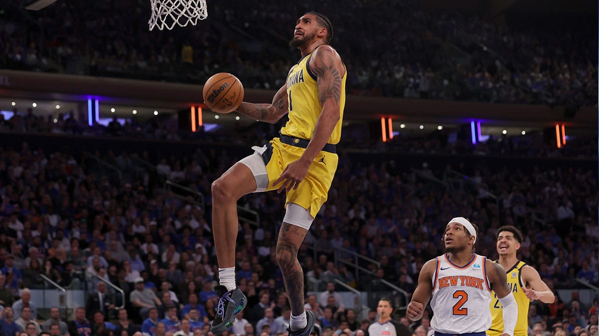 Indiana Pacers forward Obi Toppin (1) drives to the basket against New York Knicks guard Miles McBride (2) during the third quarter of game one of the second round of the 2024 NBA playoffs at Madison Square Garden. 