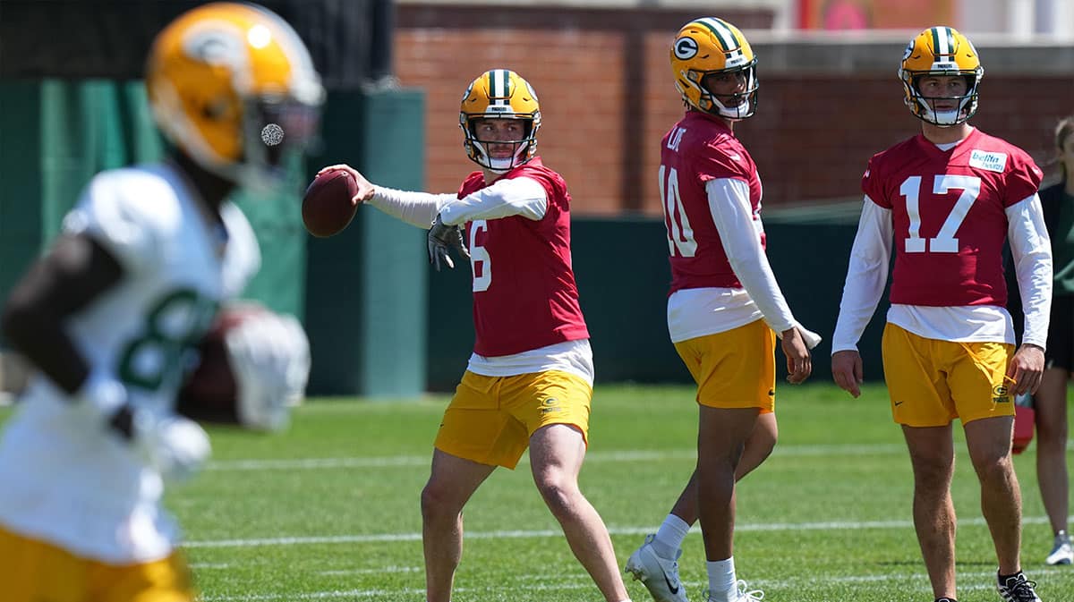 Green Bay Packers quarterback Sean Clifford (6) is shown during organized team activities Wednesday, May 29, 2024 in Green Bay, Wisconsin. Also shown are quarterbacks Jordan Love (10) and Michael Pratt (17).