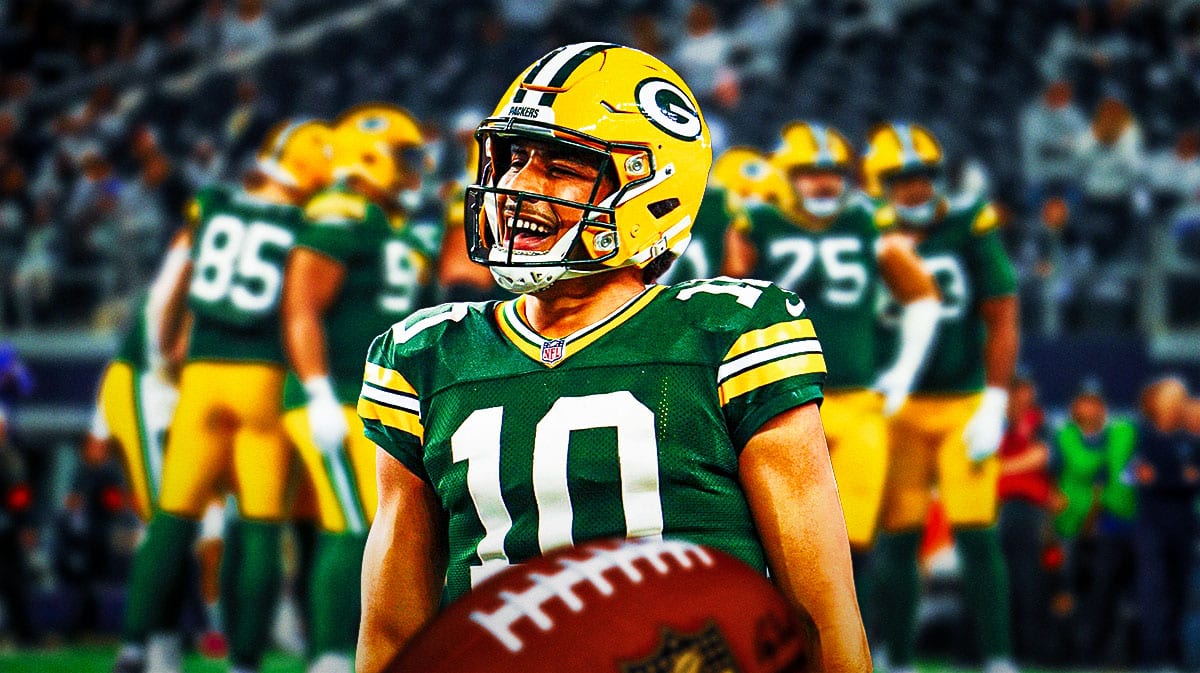Jordan Love smiling with Green Bay Packers players behind him.
