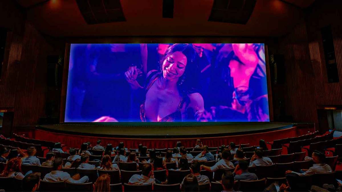 Anora photo inside a movie theater screen with audience