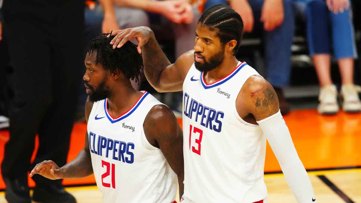 Los Angeles Clippers guard Paul George (13) and Patrick Beverley (21) against the Phoenix Suns in game five of the Western Conference Finals for the 2021 NBA Playoffs at Phoenix Suns Arena. 