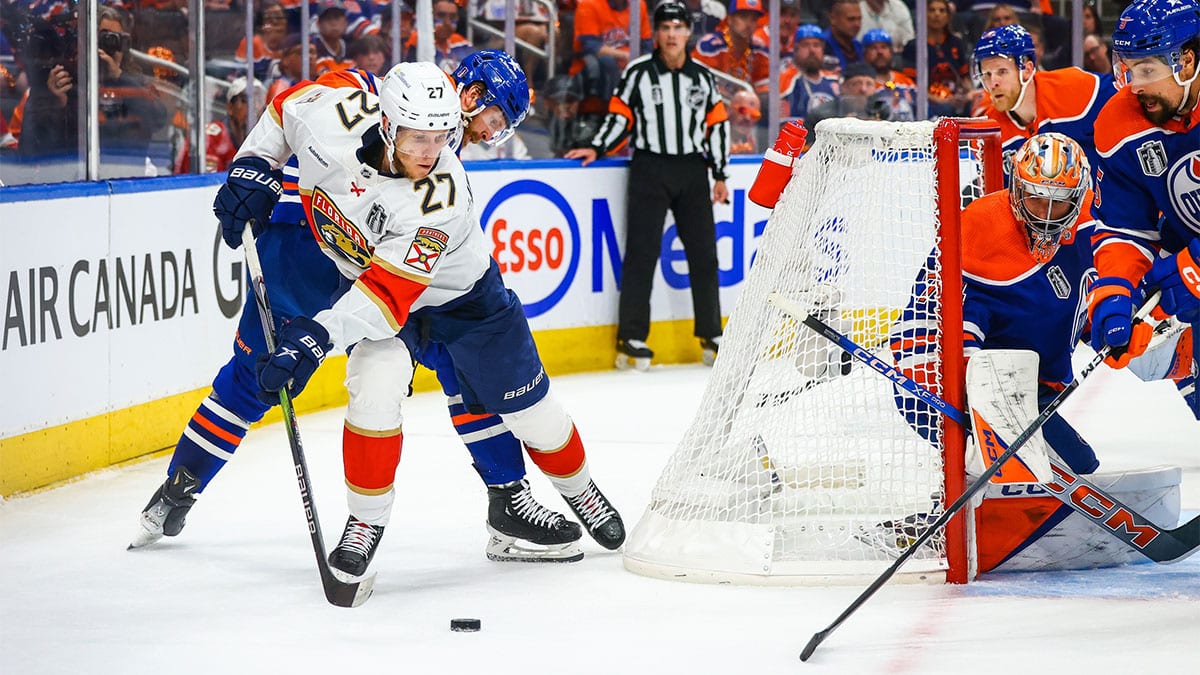 Florida Panthers center Eetu Luostarinen (27) controls the puck behind Edmonton Oilers goaltender Stuart Skinner (74) net during the first period in game six of the 2024 Stanley Cup Final at Rogers Place.