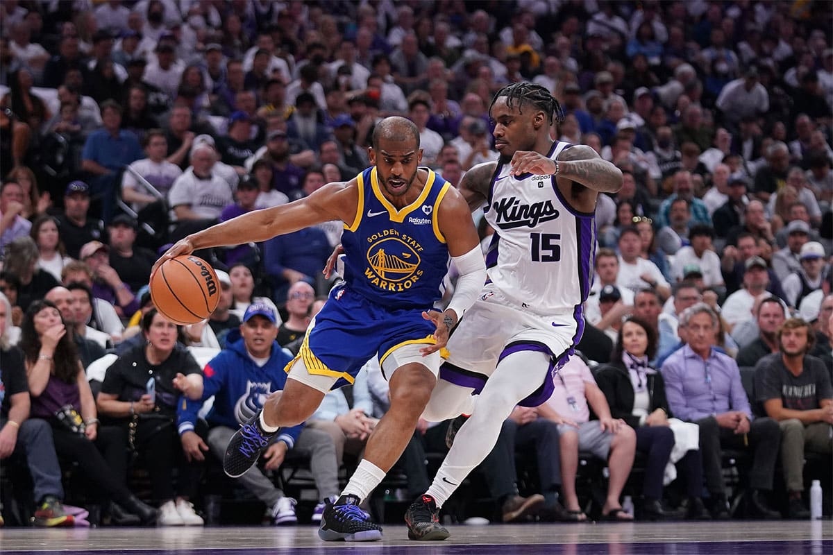 Apr 16, 2024; Sacramento, California, USA; Golden State Warriors guard Chris Paul (3) dribbles the ball next to Sacramento Kings guard Davion Mitchell (15) in the second quarter during a play-in game of the 2024 NBA playoffs at the Golden 1 Center. Mandatory Credit: Cary Edmondson-USA TODAY Sports
