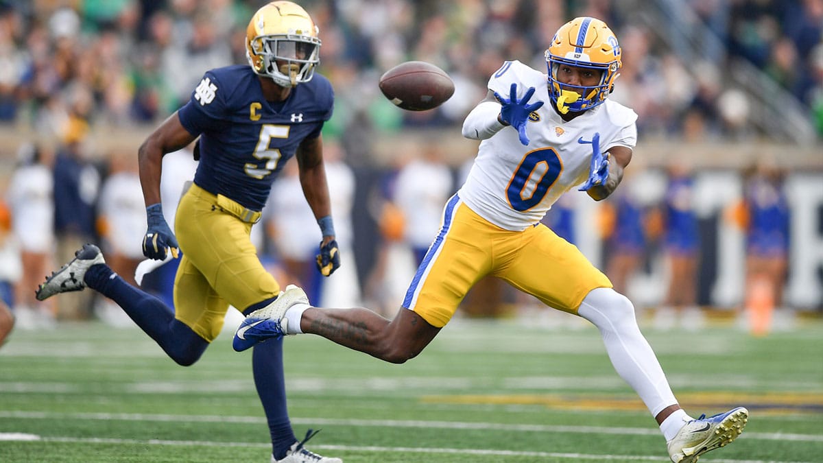 Pittsburgh Panthers wide receiver Bub Means (0) catches a pass against Notre Dame Fighting Irish cornerback Cam Hart (5) in the second quarter at Notre Dame Stadium. 