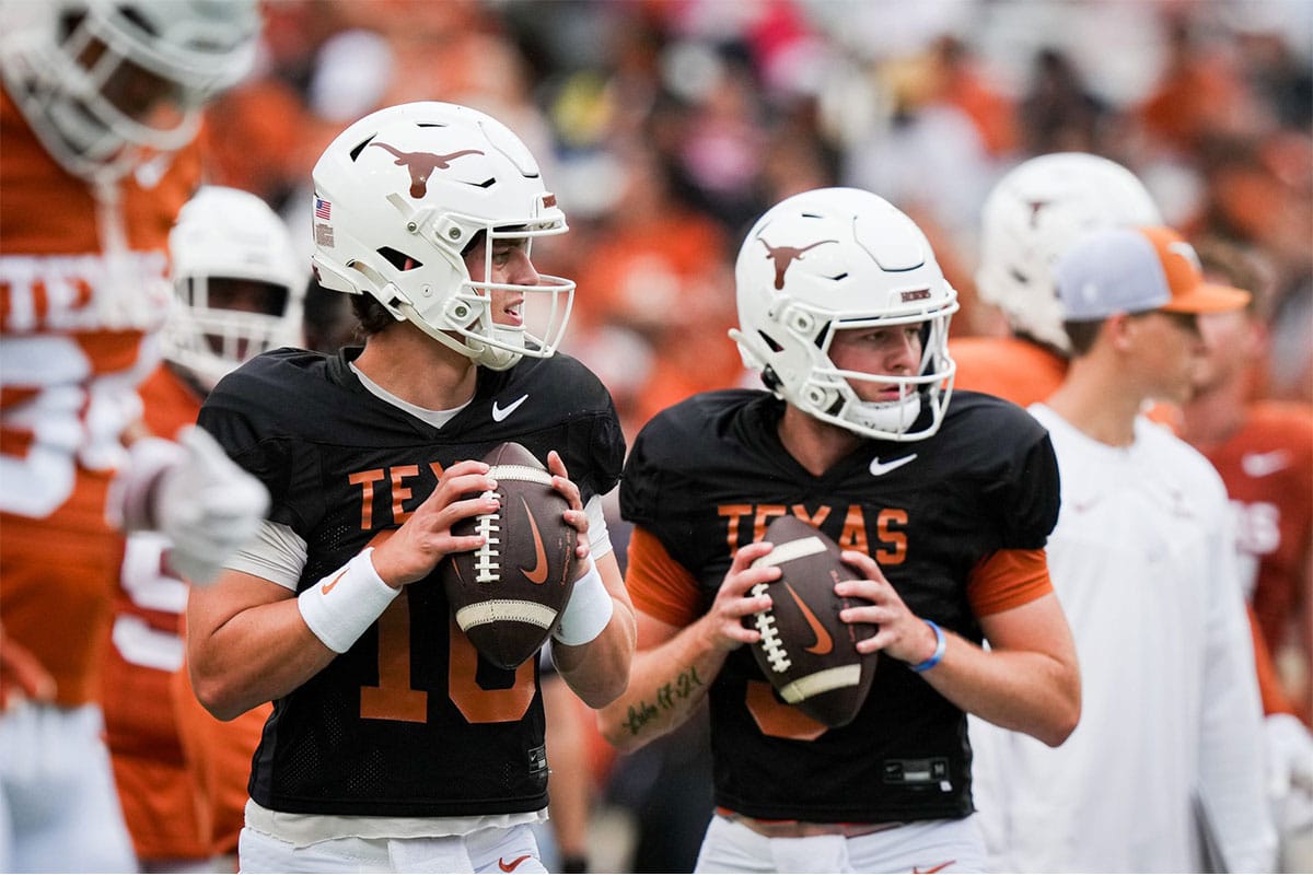 Texas Longhorns quarterbacks Arch Manning (16), left, and Quinn Ewers (3) throw passes while warming up ahead of the Longhorns' spring Orange and White game at Darrell K Royal Texas Memorial Stadium