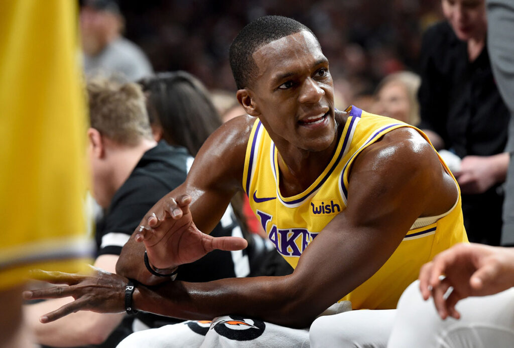 Los Angeles Lakers guard Rajon Rondo (9) speaks to his teammates during a timeout in the second half of the game against the Portland Trail Blazers at the Moda Center. The Lakers won the game 114-110. 