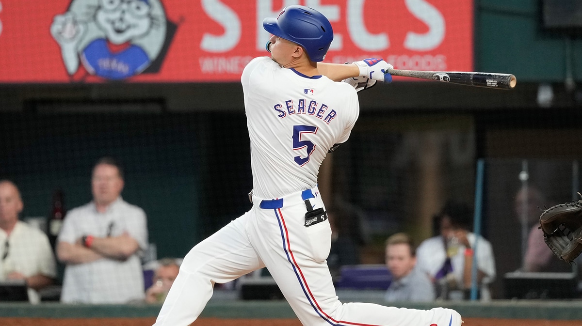 Texas Rangers shortstop Corey Seager (5) follows through on his two-run home run against the Arizona Diamondbacks during the fifth inning at Globe Life Field.