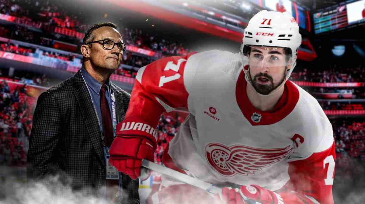 Dylan Larkin receiving Red Wings news from Steve Yzerman.