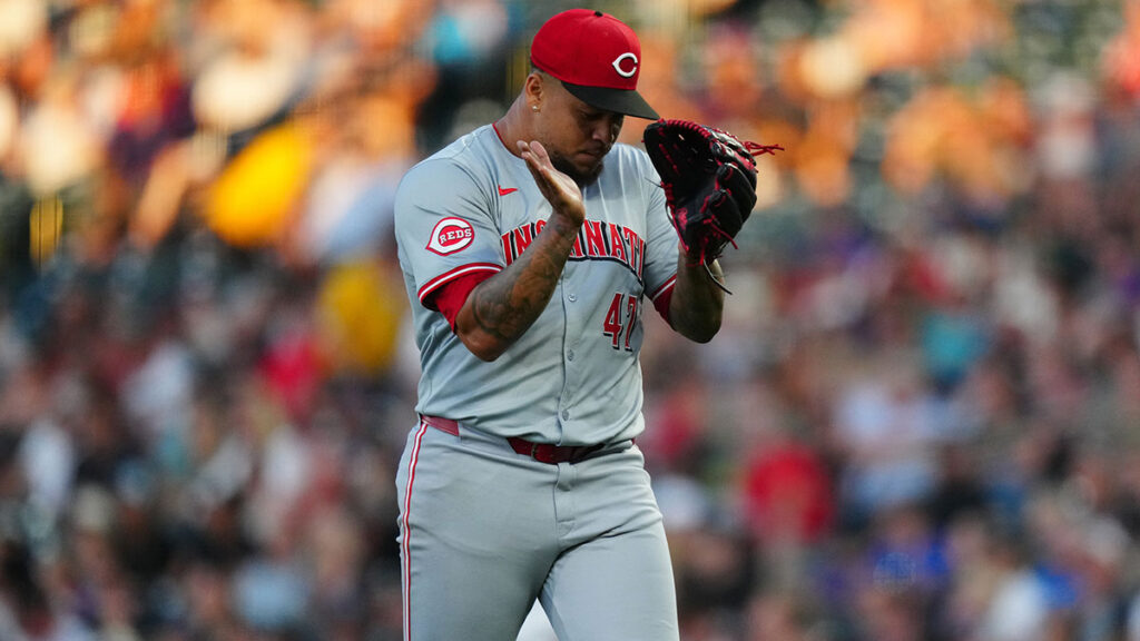 Reds starting pitcher Frankie Montas (47) reacts in the sixth inning against the Colorado Rockies at Coors Field