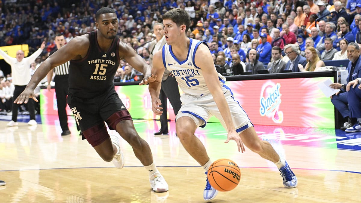 Kentucky Wildcats guard Reed Sheppard (15) drives baseline past Texas A&M Aggies forward Henry Coleman III (15) during the second half at Bridgestone Arena.