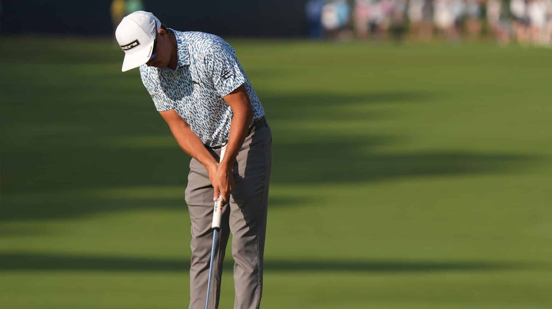 Rickie Fowler putts on the first green during the first round of the U.S. Open golf tournament.