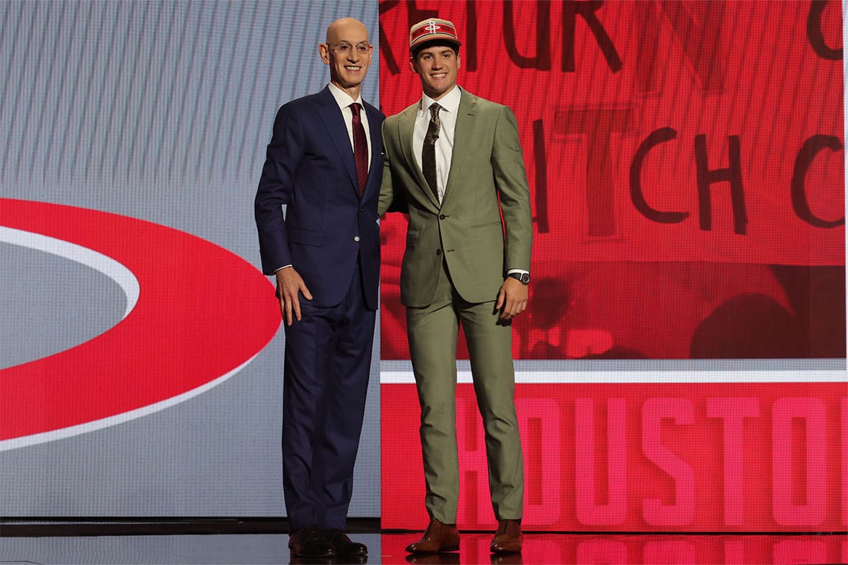 Reed Sheppard poses for photos with NBA commissioner Adam Silver after being selected in the first round by the Houston Rockets in the 2024 NBA Draft at Barclays Center. 