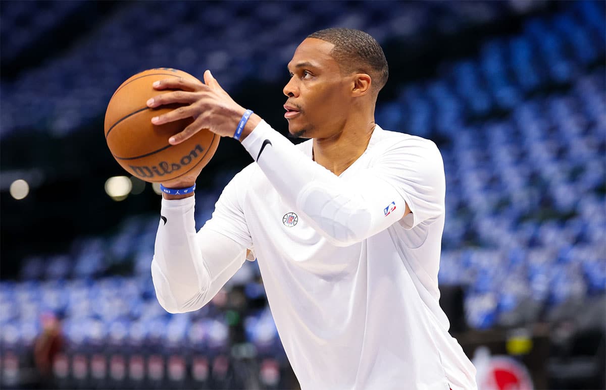 LA Clippers guard Russell Westbrook (0) warms up before the game against the Dallas Mavericks during game four of the first round for the 2024 NBA playoffs at American Airlines Center.