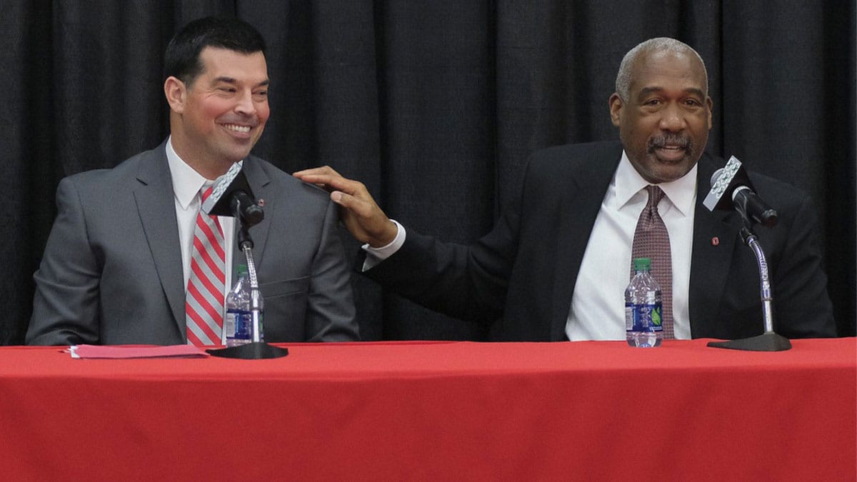 Ohio State Buckeyes athletics director Gene Smith pats offensive coordinator Ryan Day during a press conference to announce Meyer's retirement and Day's hiring as head football coach at Ohio State's Fawcett Center in Columbus on Dec. 4, 2018.