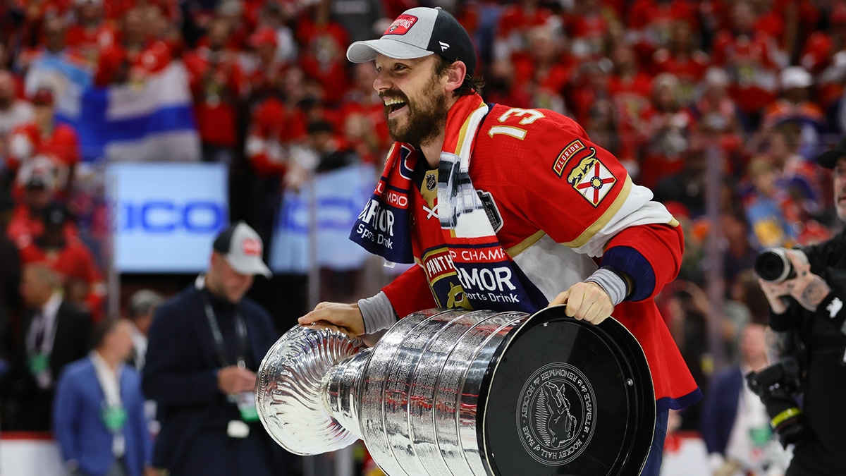 Panthers center Sam Reinhart (13) skates with the cup after winning game seven of the 2024 Stanley Cup Final against the Edmonton Oilers at Amerant Bank Arena.