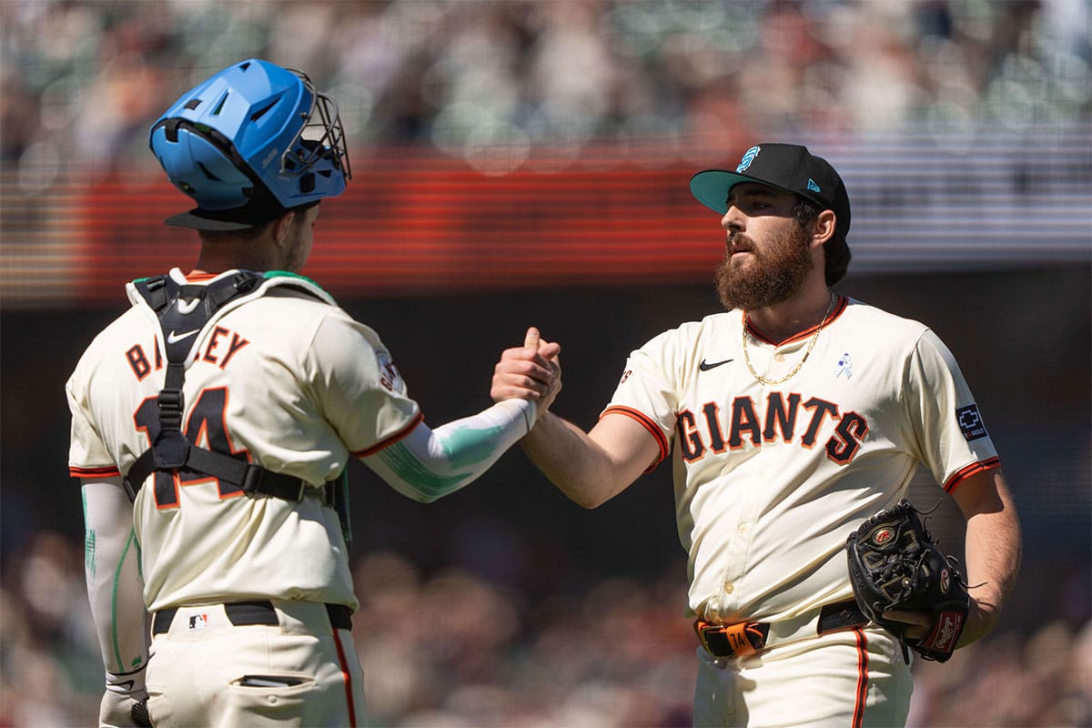 San Francisco Giants catcher Patrick Bailey (14) and relief pitcher Ryan Walker (74) celebrate after defeating the Los Angeles Angels at Oracle Park. 