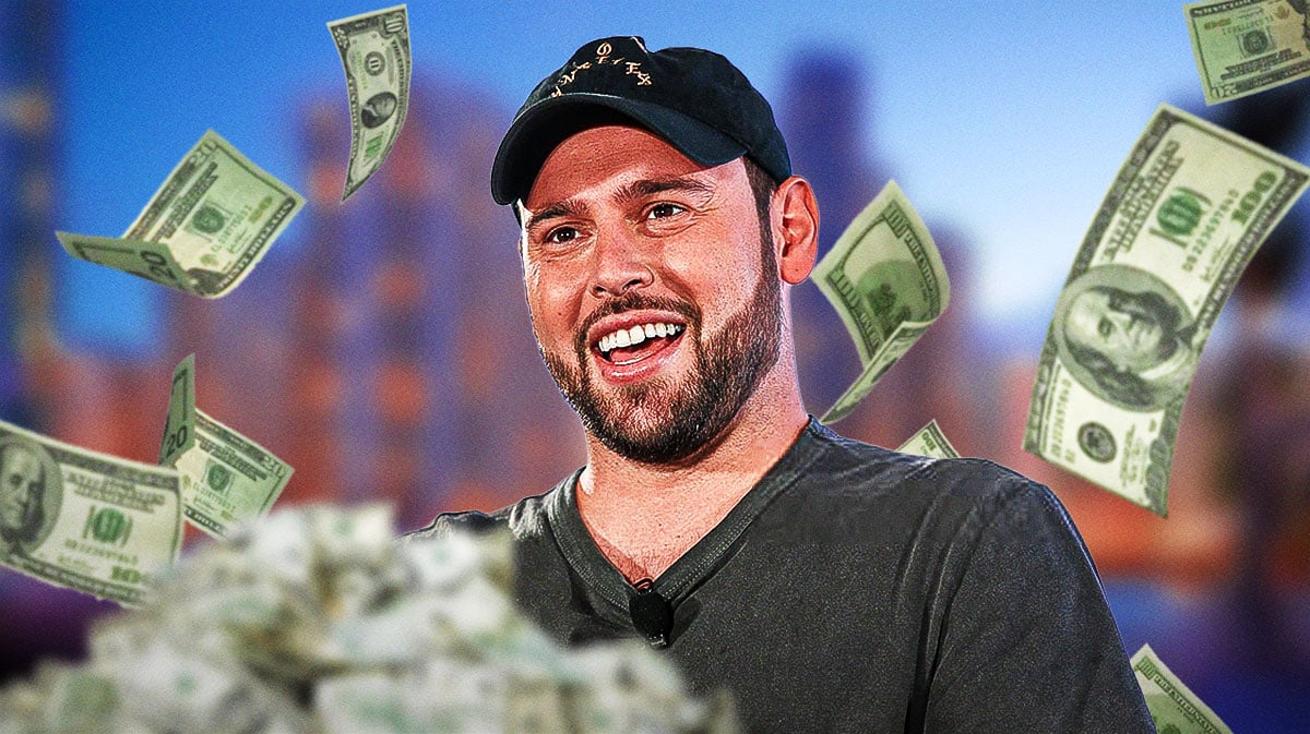 Scooter Braun with money around him.
