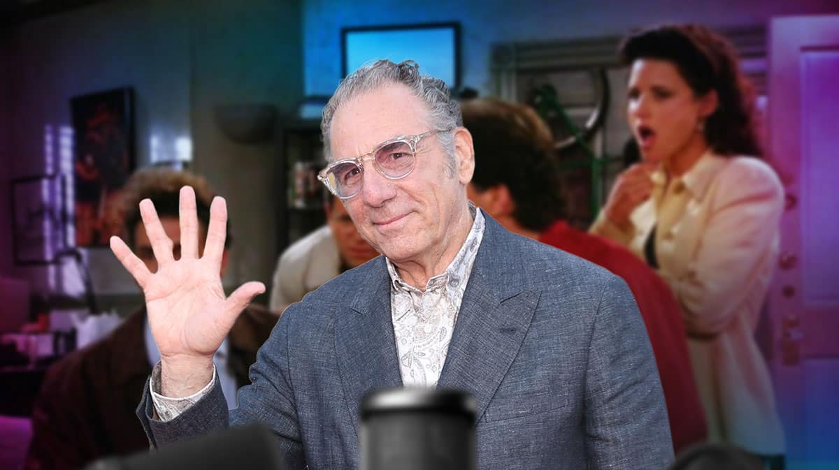 Michael Richards with a scene from Seinfeld behind him.