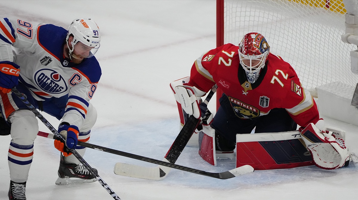 Edmonton Oilers forward Connor McDavid (97) shoots the puck against Florida Panthers goaltender Sergei Bobrovsky (72) during the first period in game one of the 2024 Stanley Cup Final at Amerant Bank Arena.
