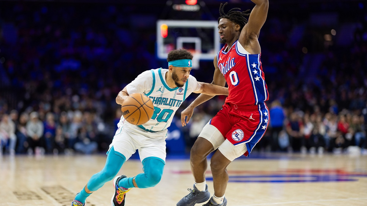 Charlotte Hornets guard Seth Curry (30) dribbles the ball against Philadelphia 76ers guard Tyrese Maxey (0) during the third quarter at Wells Fargo Center