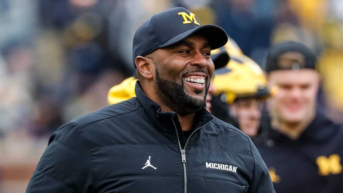 Michigan head coach Sherrone Moore watches warm up during the spring game at Michigan Stadium