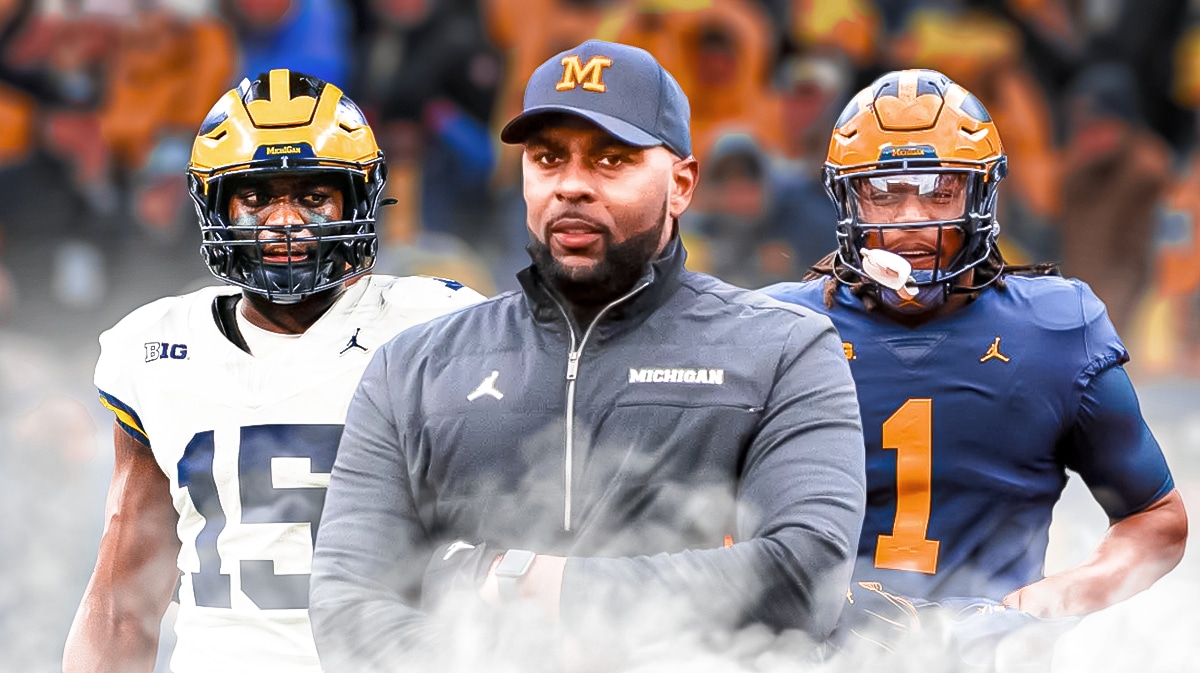 Sherrone Moore. Ernest Hausmann and Jaishawn Barham in Michigan uniforms