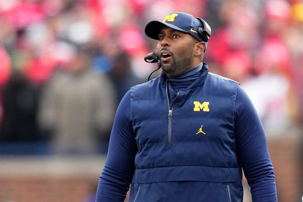 Michigan Wolverines interim head coach Sherrone Moore talks on the sideline during the NCAA football game against the Ohio State Buckeyes at Michigan Stadium. Ohio State lost 30-24.