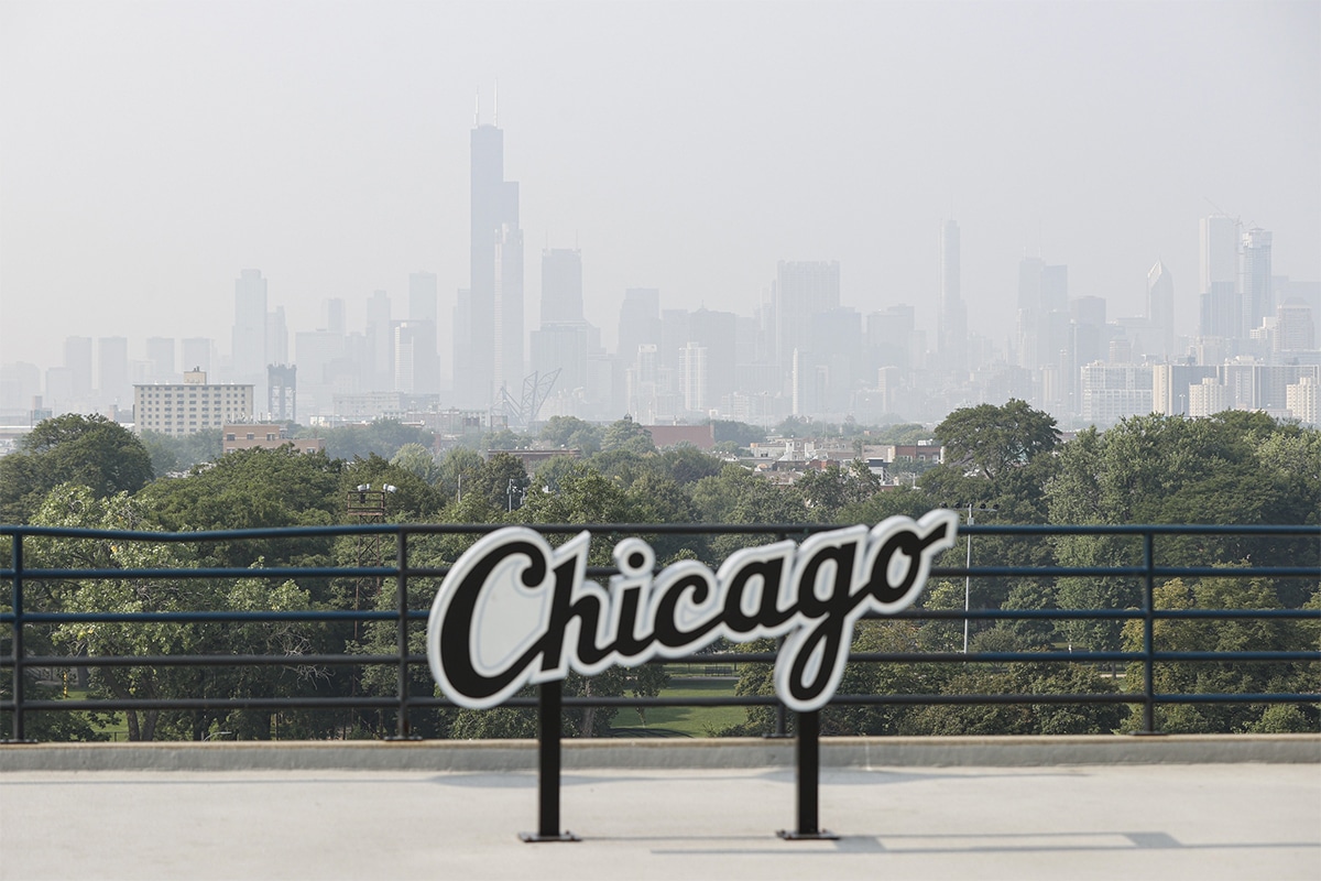  Chicago's skyline is seen from the Guaranteed Rate Field with heavy smoke from the Canadian wildfires blanketing the city, before a baseball game between the Chicago White Sox and Chicago Cubs, Sky arena in background