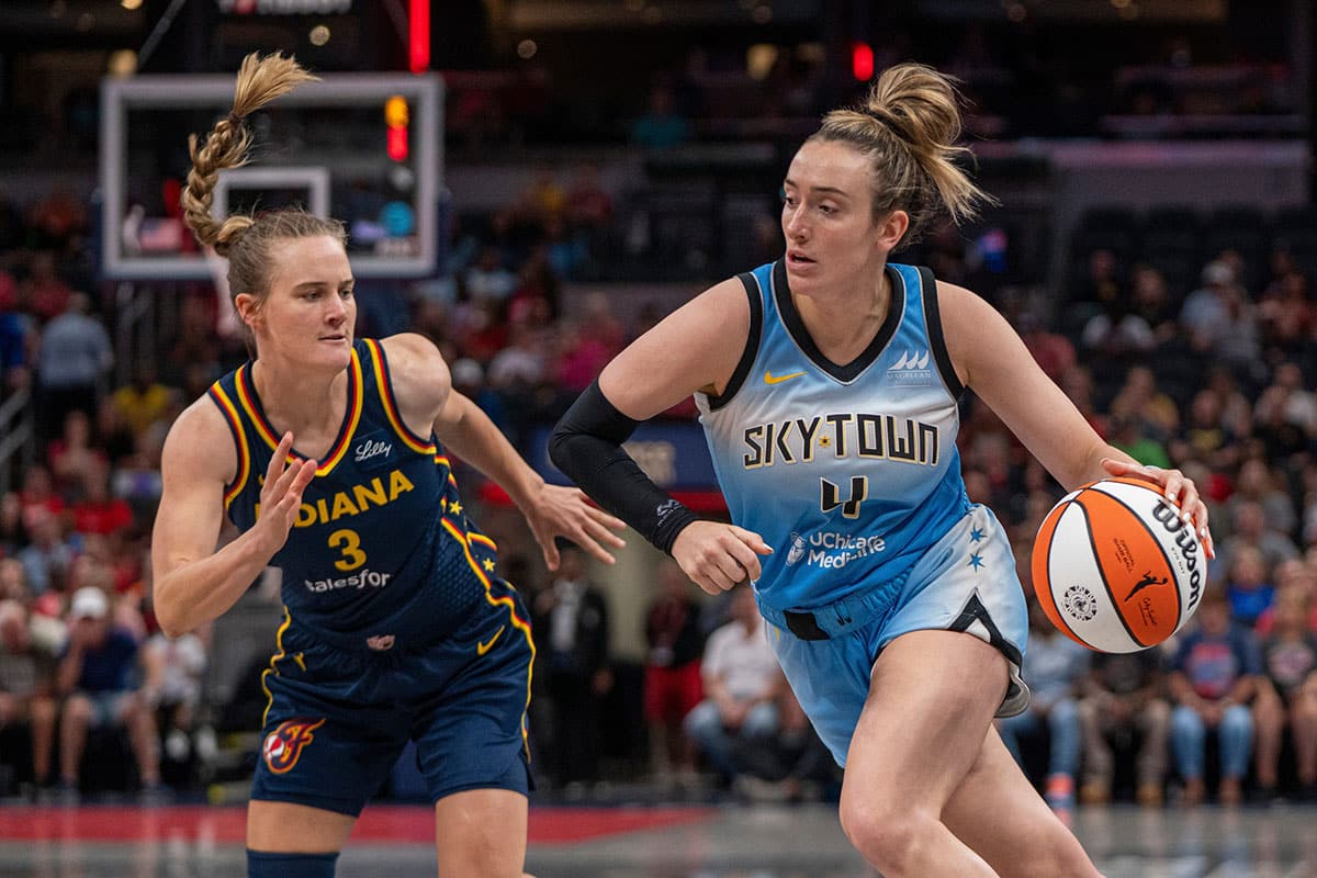 Chicago Sky guard Marina Mabrey (4) dribbles around Indiana Fever guard Kristy Wallace (3) 